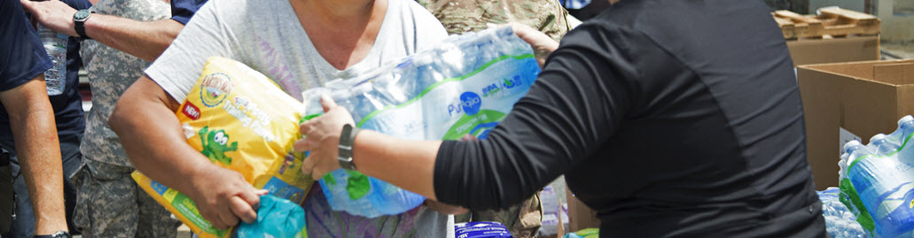 Survivors gather food and water from a police station.