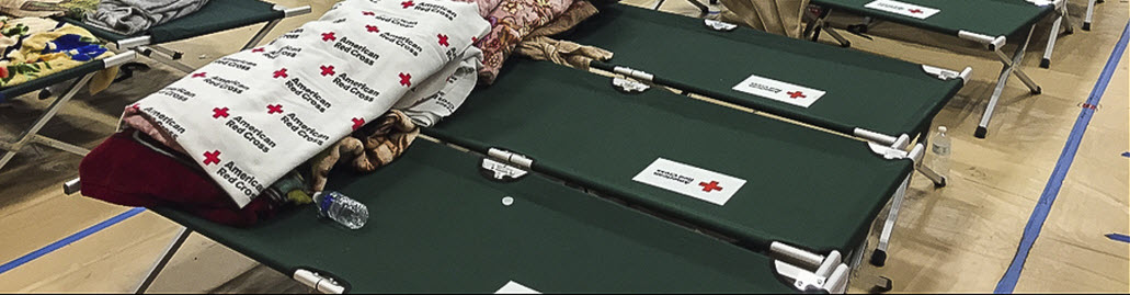 Red Cross shelter in a high school gymnasium